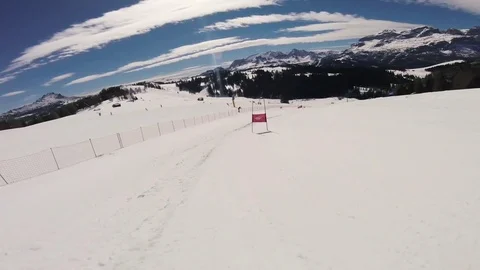 A skier doing slalom in the Alpine mountains Stock Footage 74139334