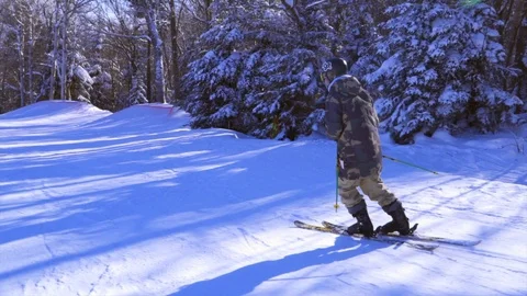 Skier doing Tricks on Rails and Jump in Terrain Park Stock Footage 129457897