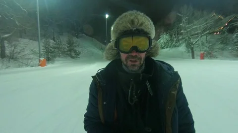 Skier Down the Mountain and Waving his Hand Forward Stock Footage 111878446