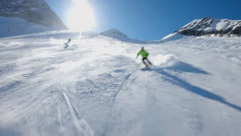 Skier in fast descent down a snowy slope, dynamic winter scene, high speed Stock Footage 332143822