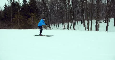 A skier in the forest. A man is doing cross-country skiing. Stock Footage 294681075