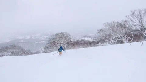 Skier going down the mountain Stock Footage 102124543