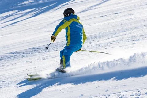 Skier going down the mountain Photos