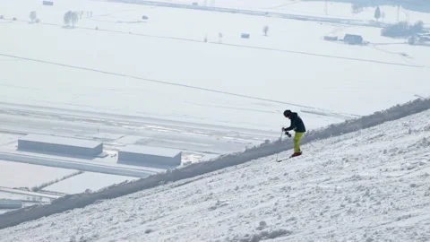 Skier going down a mountain in slow motion Stock Footage 231550682