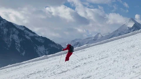 Skier going down a mountain in slow motion Stock Footage 231550693