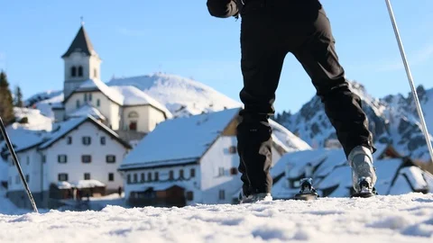 A skier  heads down the mountain after prepping their ski equipment. Stock Footage 123954399