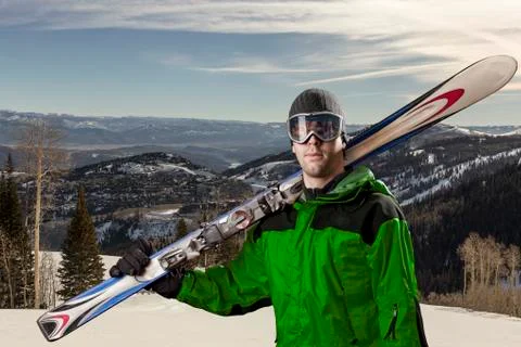 Skier holding a pair of skis Stock Photos