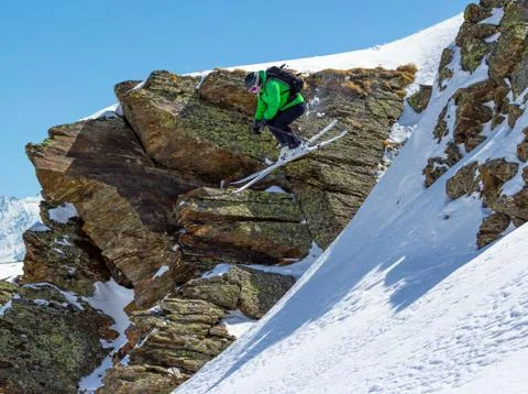 Skier jumping off a cliff Stock Photos