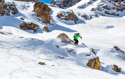 Skier jumping off a cliff Stock Photos