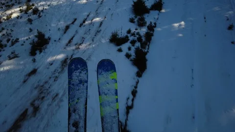 Skier legs top view on ski lift. Pov skier on lift looking down. Stock Footage 123725837