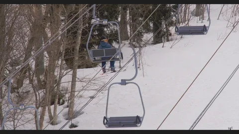 Skier on a lift Stock Footage 89889677