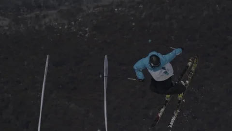 Skier light blue/white performs thrice turn jump. Stock Footage 81882403