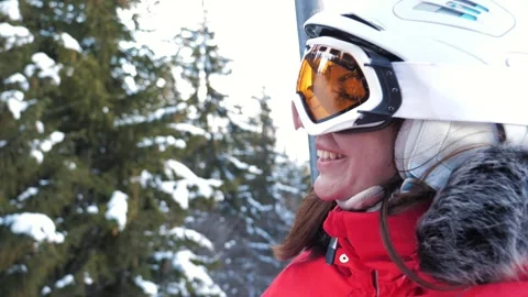 Skier looking at snowy mountain landscape elevated on top from chairlift Stock Footage 320016702