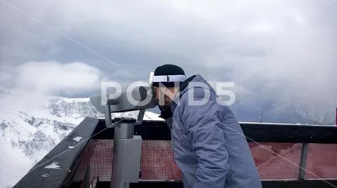 The skier looks through the telescope Stock Photos