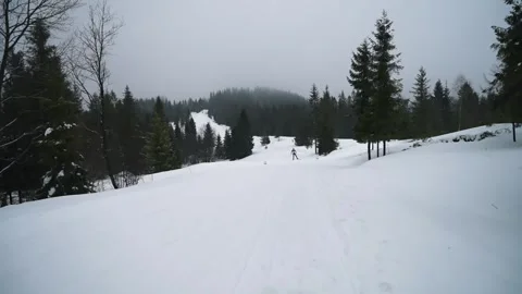 A skier moves towards the camera on speed skis. Ski racing sportsmen and women Stock Footage 265501028