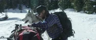 Skier Packing His Backpack On Mountain Slope Stock Footage
