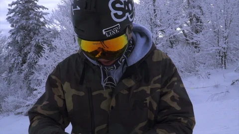 Skier putting gloves on Stock Footage 129457655