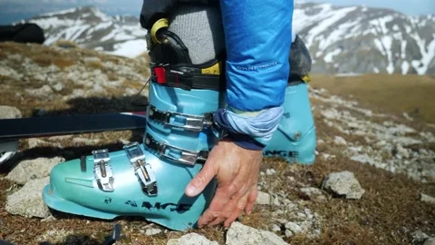 Skier Putting His Ski Boots. Man Ready For Skiing Stock Footage 252728783