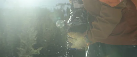 Skier removing boot binding from his ski Stock Footage 68495898