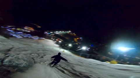 A skier rides down a mountain slope view from a high-speed drone Stock Footage 167428702