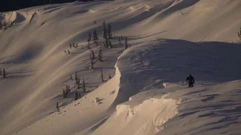 Skier on rides up at sunset Stock Footage 94408456