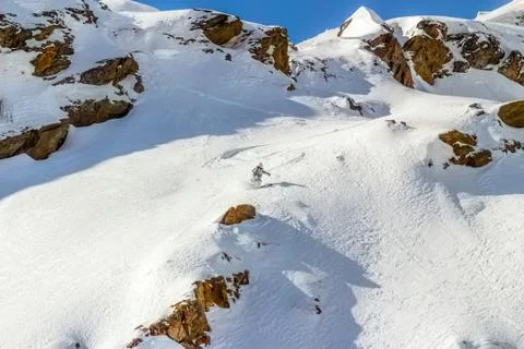 Skier in the rocks Stock Photos