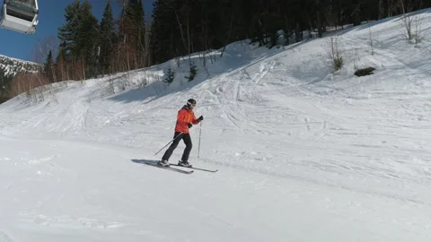 A Skier Rolls Down The Mountainside Pushing Off With Sticks To Gain Speed Stock Footage 162057465