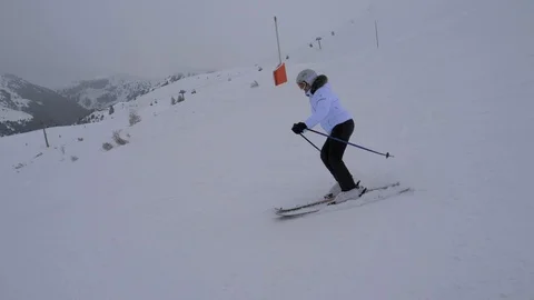Skier Skiing Down Carving On The Slope In The Mountains In Winter In The Fog Stock Footage 91769386
