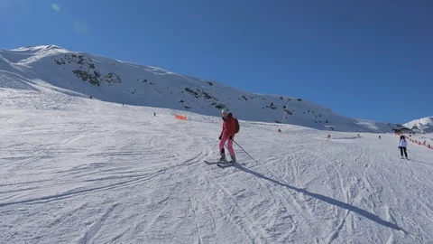 Skier Skiing Down The Ski Slope Along The Mountain In Winter Sunny Day Video stock 91897167