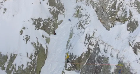 Skier skiing down the slope of alps and tourists balancing on the rope Stock Footage 108637625