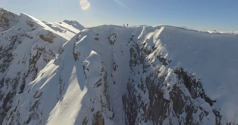Skier skiing down the slope of snow covered alps Stock Footage 108636917