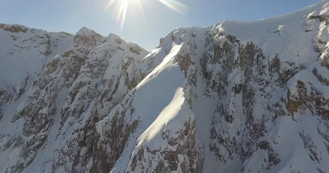Skier skiing down the slope of snow covered alps Stock Footage 108637124
