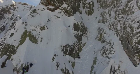 Skier skiing down the slope of snow covered alps Stock Footage 108637133