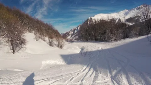 A skier skiing in mountains, action camera footage Stock Footage 88430761