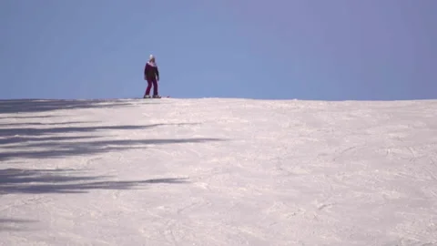 Skier slides down the mountain Stock Footage 198469071