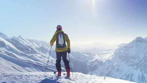Skier on a snow-covered mountain and observes the landscape, Alps, France Stock Footage 239790906