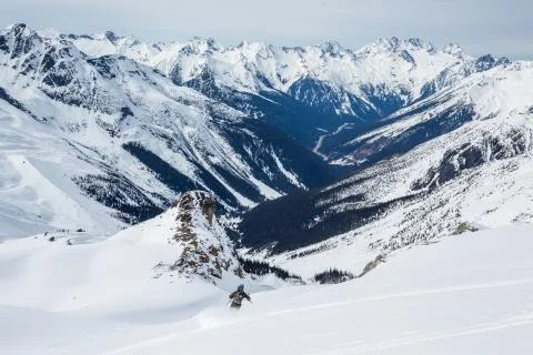 Skier starting down the Seven Steps to Paradise in Rogers Pass. 50 Classic Sk Stock Photos