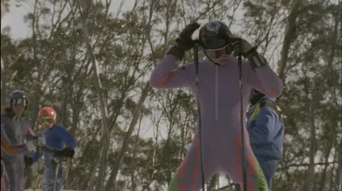 A skier starts to ski downhill. Stock Footage