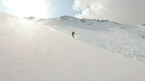 Skier on steep slope Stock Footage 798194