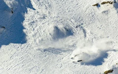 Skier on a steep slope Stock Photos
