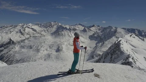 Skier on top of mountain Stock Footage 83572781