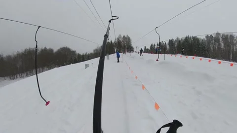 Skier Using T-bar Ski Tow Drag Lift POV Stock Footage 149827041