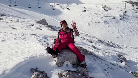 A skier waving goodbye while drone flying away Stock Footage 123729759