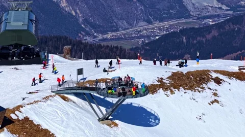 Skiers on alpine observation deck at snowy Serfaus Fiss Ladis, Austria Video stock 334267442