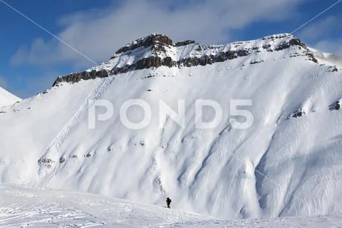 Skiers and off-piste slope with traces of skis, snowboards and avalanches Stock Photos