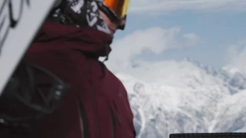Skiers and snowboarders exit a cable car cabin, ready to hit the slopes with Stock Footage 304502148