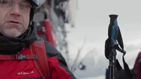 Skiers and snowboarders exit a cable car cabin, ready to hit the slopes with Stock Footage 304504228