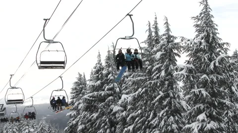 Skiers And Snowboarders On Lift Video stock 59293416