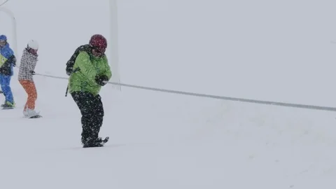 Skiers coming up with an installation cable to the upper end of pistes Stock Footage 71169235