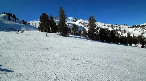 SKIERS DOWN MOUNTAIN Stock Footage 1011481